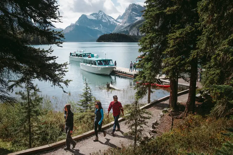 Visitors on the Spirit Island viewpoint trail with the cruise boat at the dock